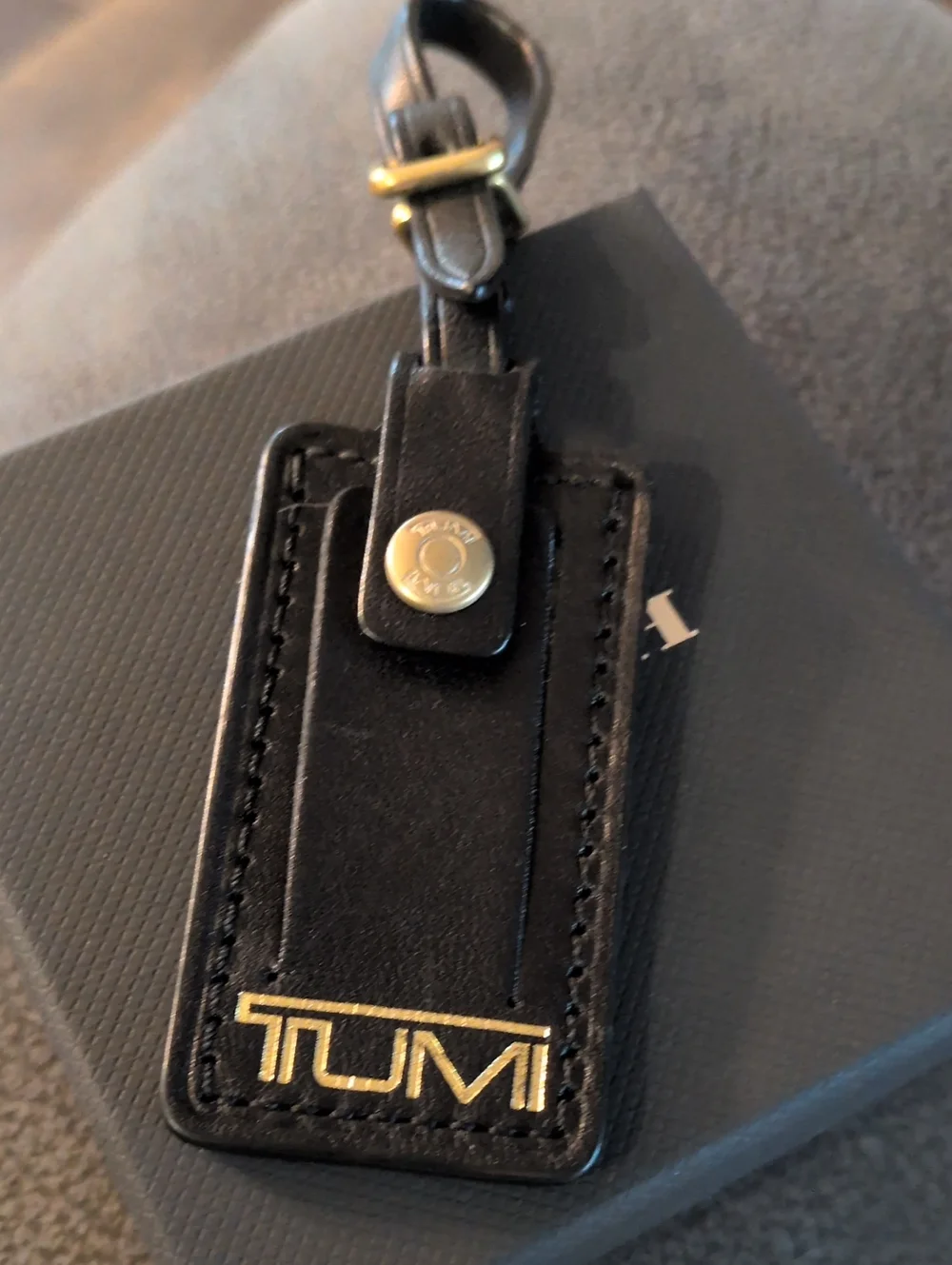 Tumi Black Leather Tag with Gold TUMI Logo
